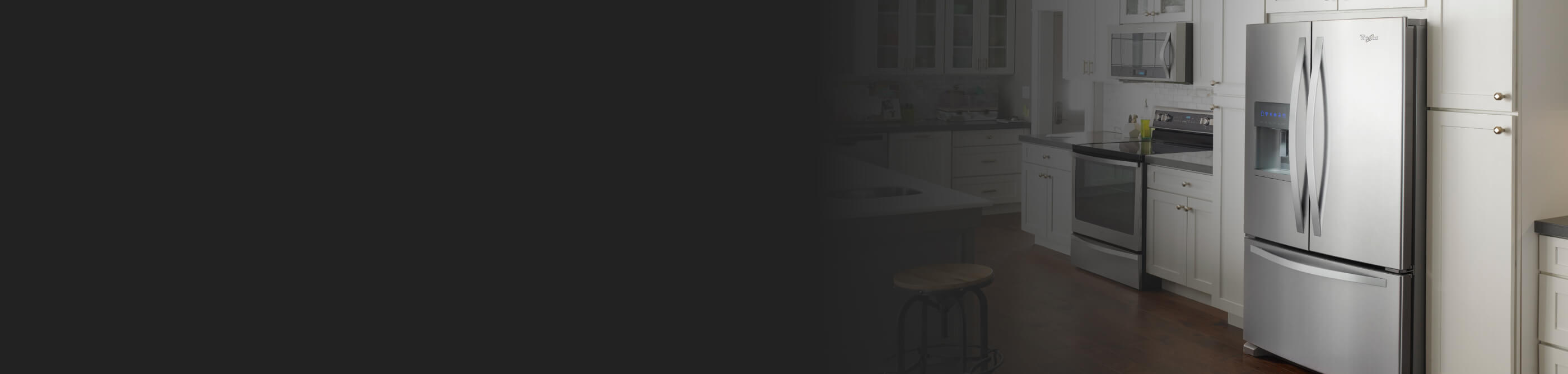 Stainless steel Whirlpool® French door refrigerator in white cabinetry