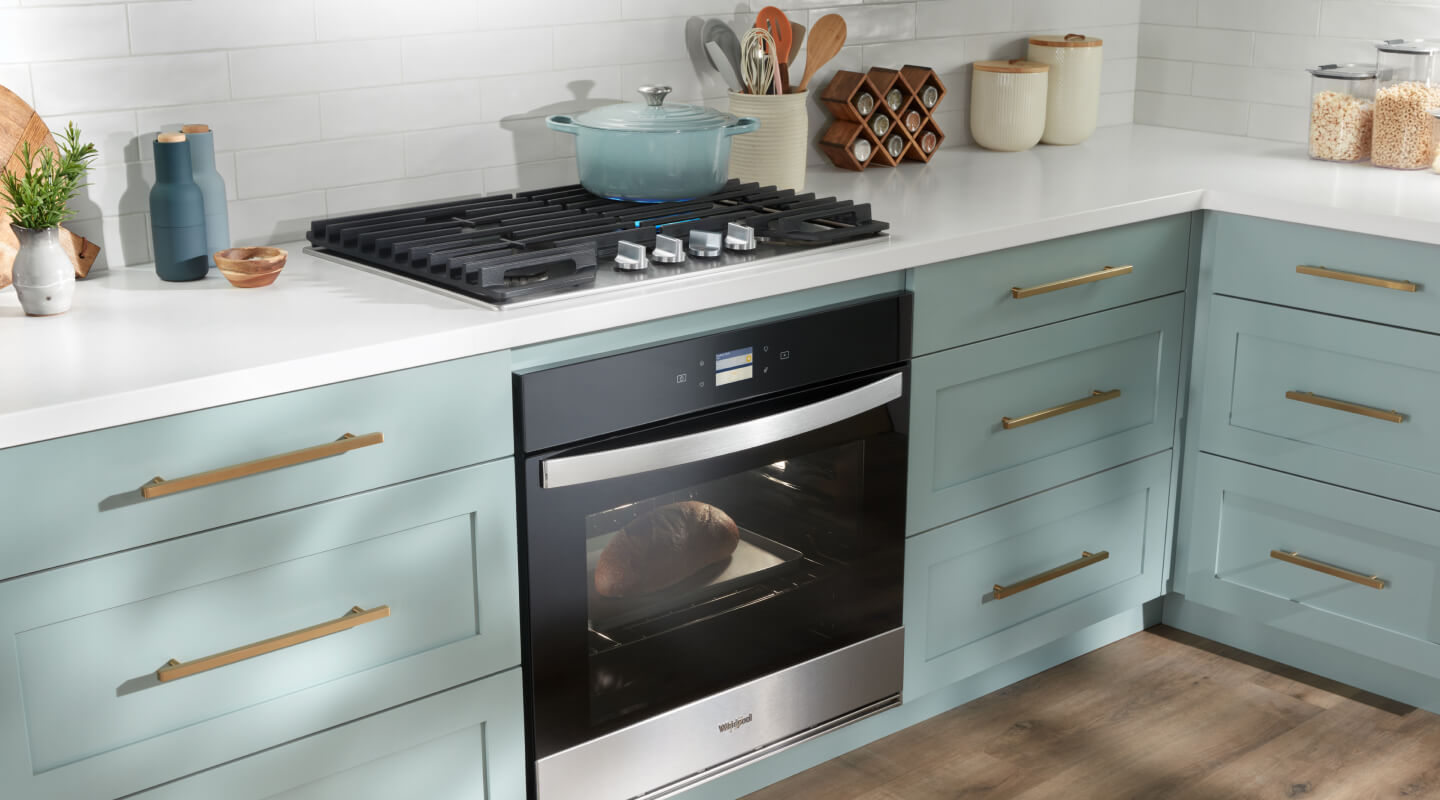 A bright kitchen with a Whirlpool® Gas Cooktop