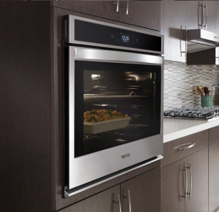  A stainless steel wall oven installed at counter height