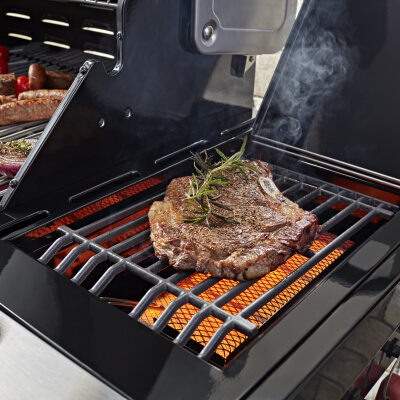Steak cooking on a grill