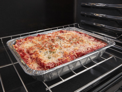 Tray of lasagna in an oven Tray of lasagna in an oven