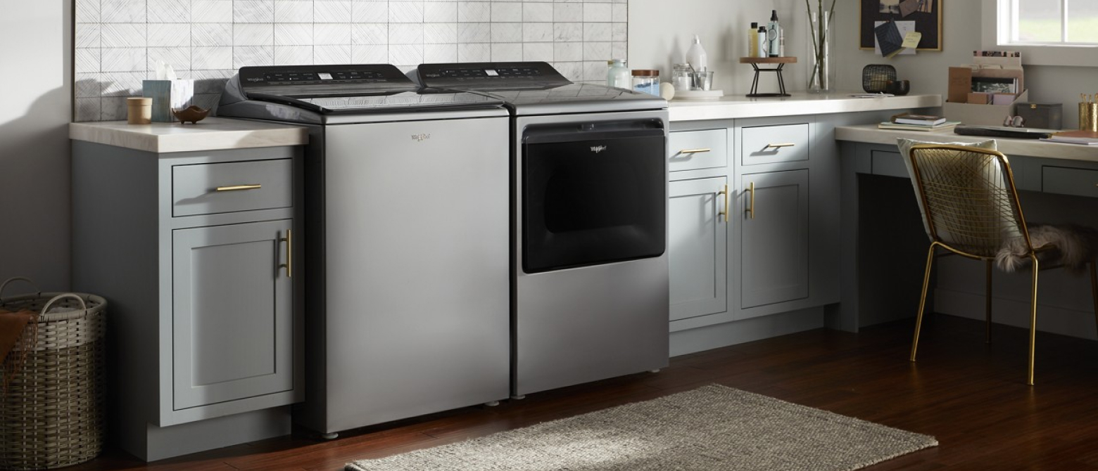 A washer and dryer pair in a laundry room.