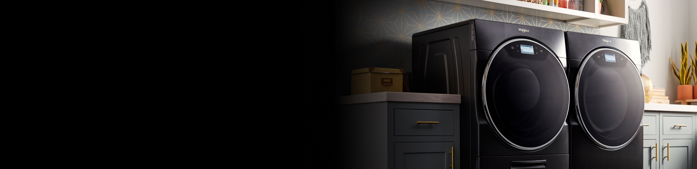 Smart washer beside a blue cabinet in a laundry room