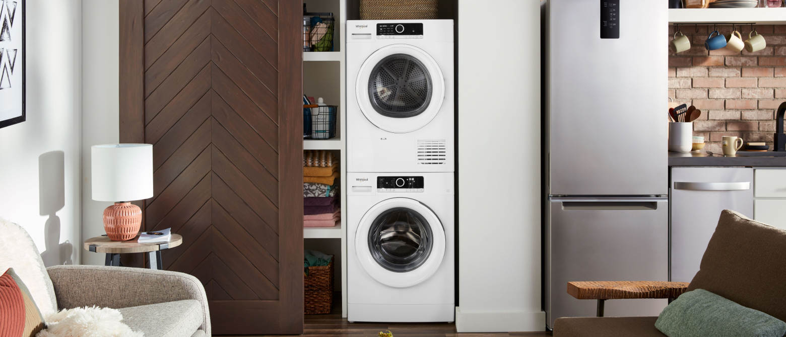 Compact laundry tower behind a sliding closet door Compact laundry tower behind a sliding closet door
