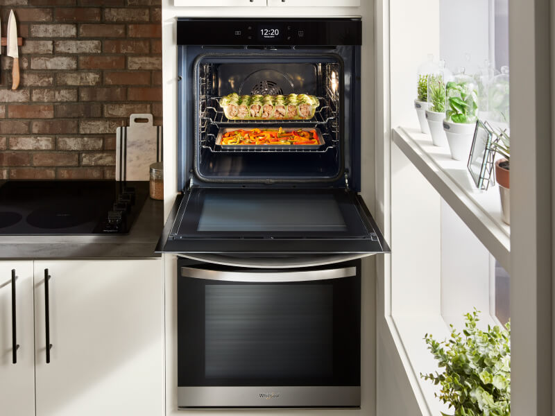 Food inside an open wall oven