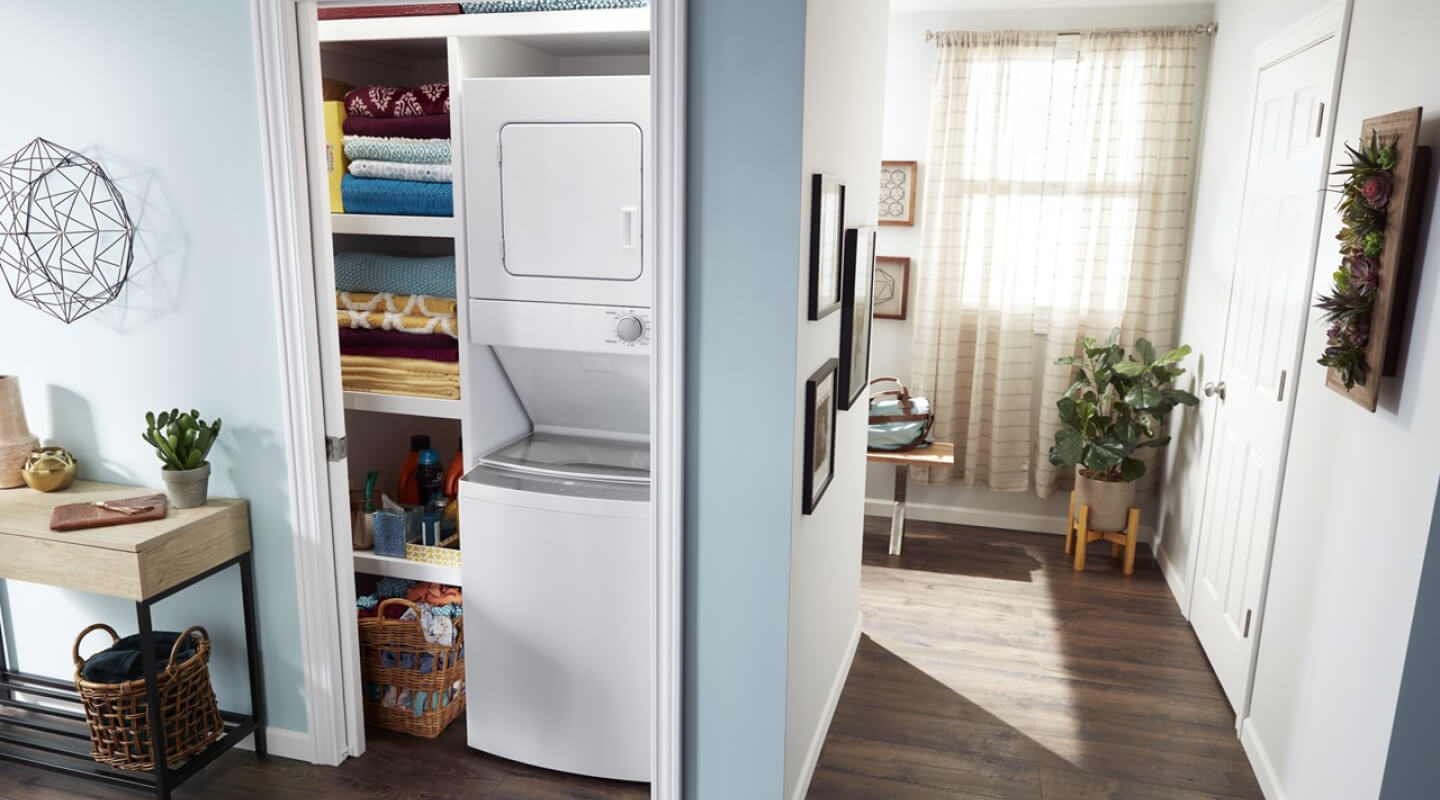 Stacked laundry center in a closet