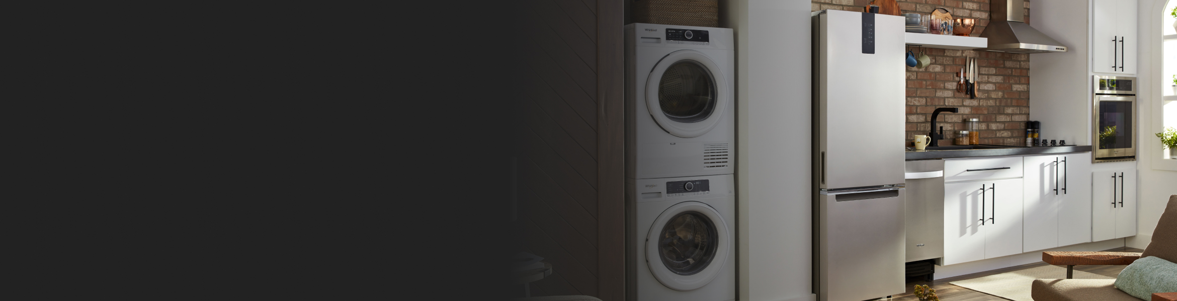 Small kitchen with compact appliances, including a washer and dryer