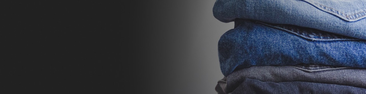 Folded jeans stacked in a pile