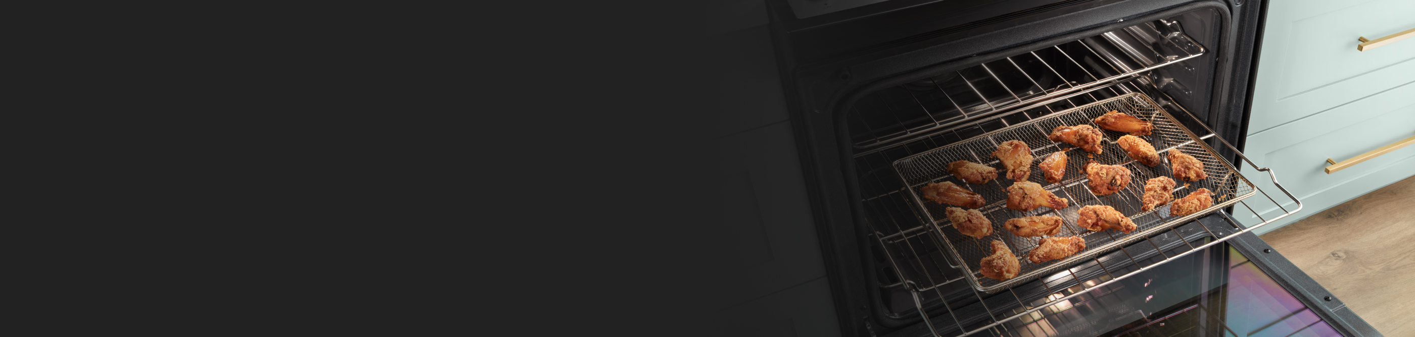 Chicken wings inside an air fryer basket