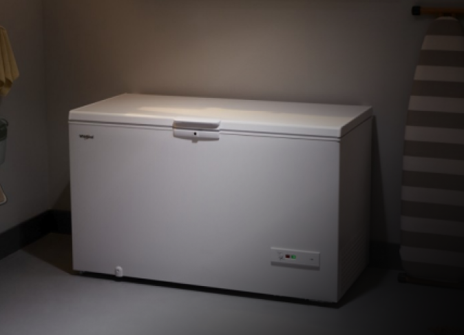 A Whirlpool® Deep Freezer in a garage