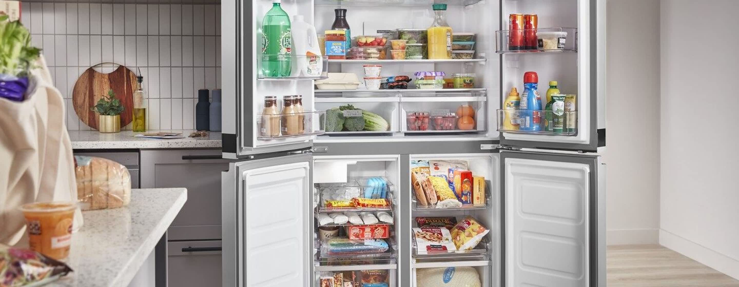 An open Whirlpool® 4 Door Refrigerator in a kitchen