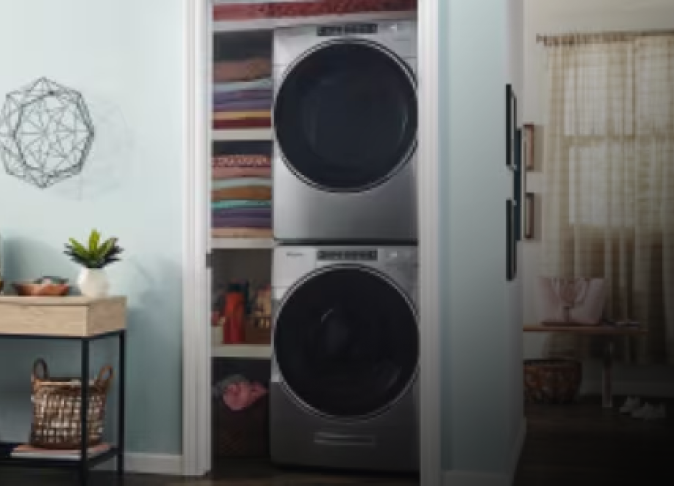 A stacked Whirlpool® washer and dryer in a closet