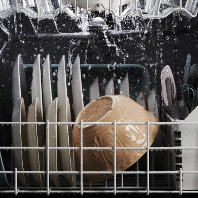 Dishes being cleaned in a dishwasher