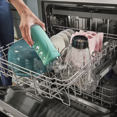 Person loading a dishwasher
