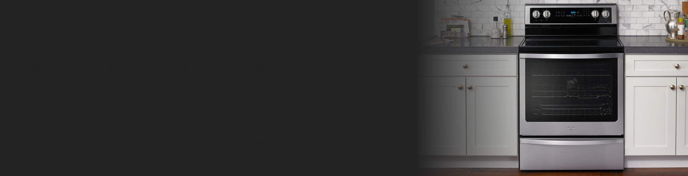 Whirlpool® Range in a kitchen with white cabinets.