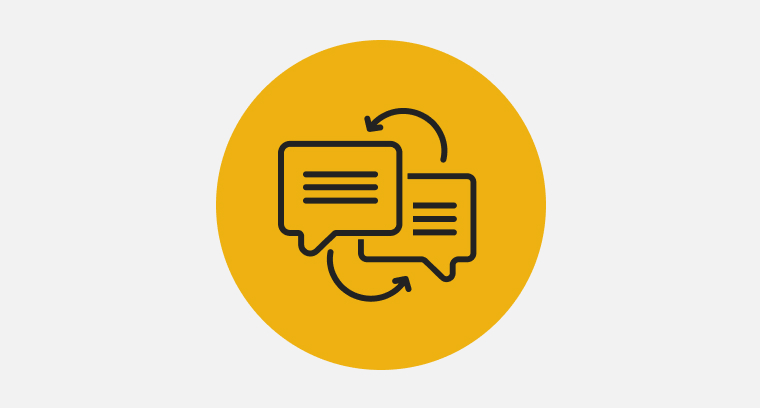 An icon of two speech bubble with arrows pointing between the two, indicating language translation.