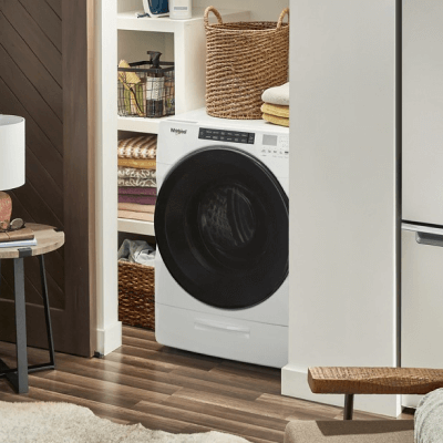 An all-in-one washer inside an apartment closet