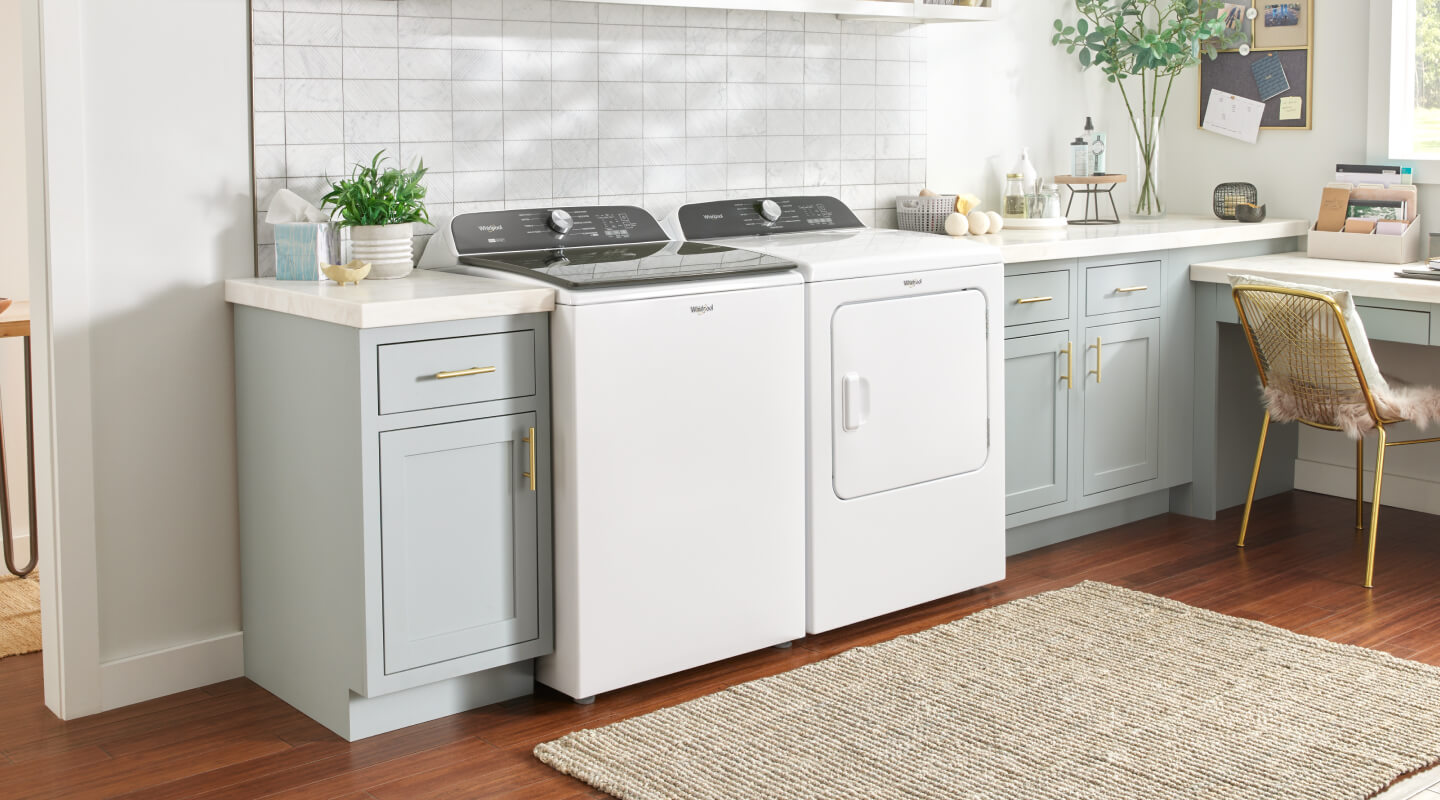 A white Whirlpool® top load washer set