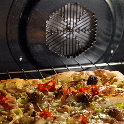 Pizza baking in an oven