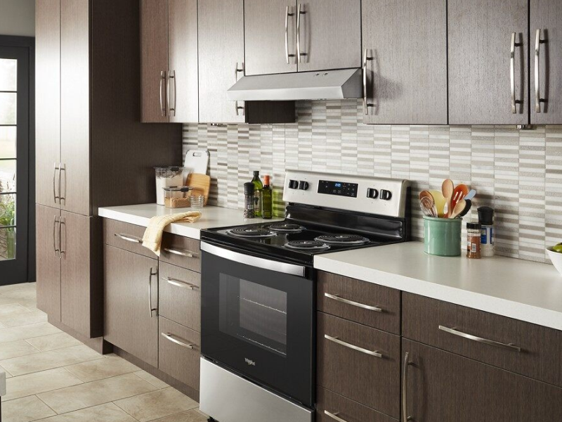 Under-cabinet range hood over a range