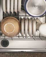 Dishes loaded inside a dishwasher
