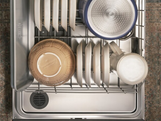Dishwasher rack filled with dishes