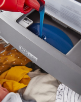 Detergent pouring into the Load & Go™ Dispenser