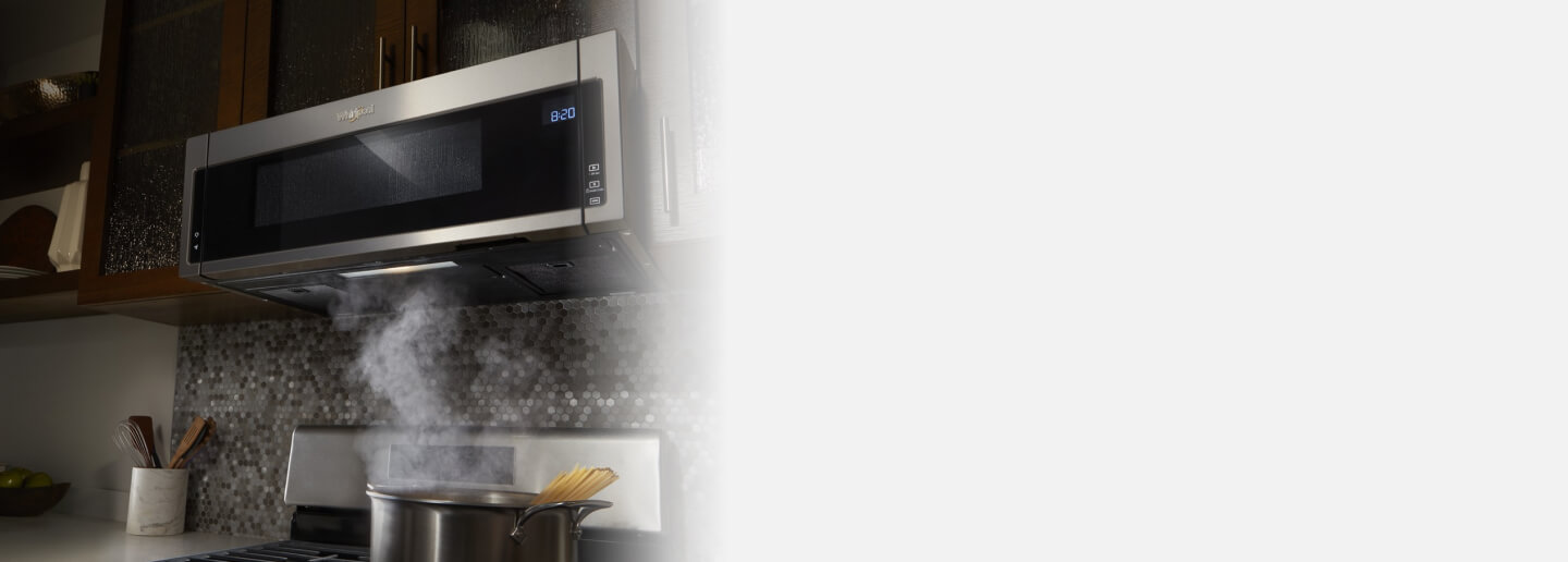 Low prifile microwave above a kitchen range