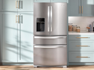 A Whirlpool® Refrigerator surrounded by light blue cabinetry