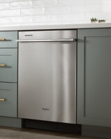 Top control dishwasher built into teal cabinets