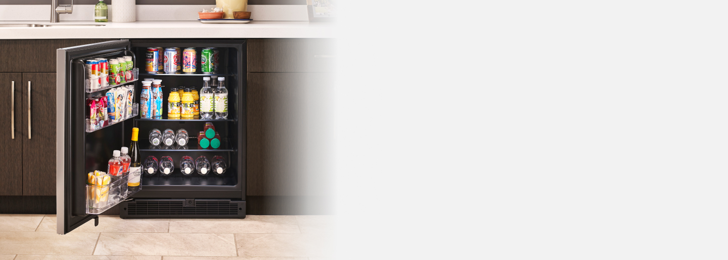 Undercounter refrigerator filled with beverages and snacks