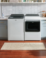 Whirlpool® Front Load Washing Machine in a laundry room