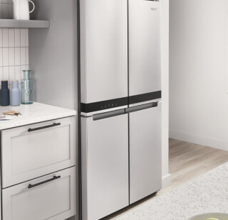 A counter-depth four-door refrigerator in a kitchen
