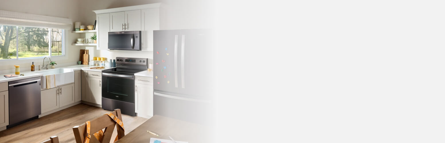 Whirlpool® appliances in a kitchen with white cabinets