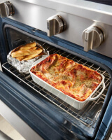 Food cooking inside a gas oven