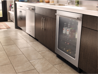Dishwasher and undercounter refrigerator in a modern kitchen