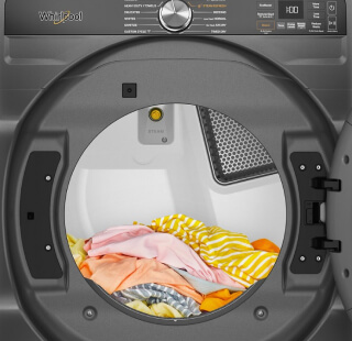 A load of colorful clothes in a dryer