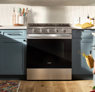 A Whirlpool® Range and blue cabinetry