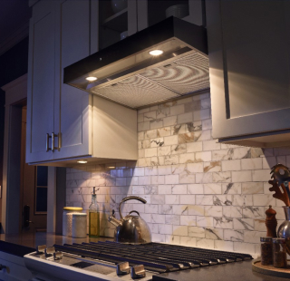 A range hood with the light on