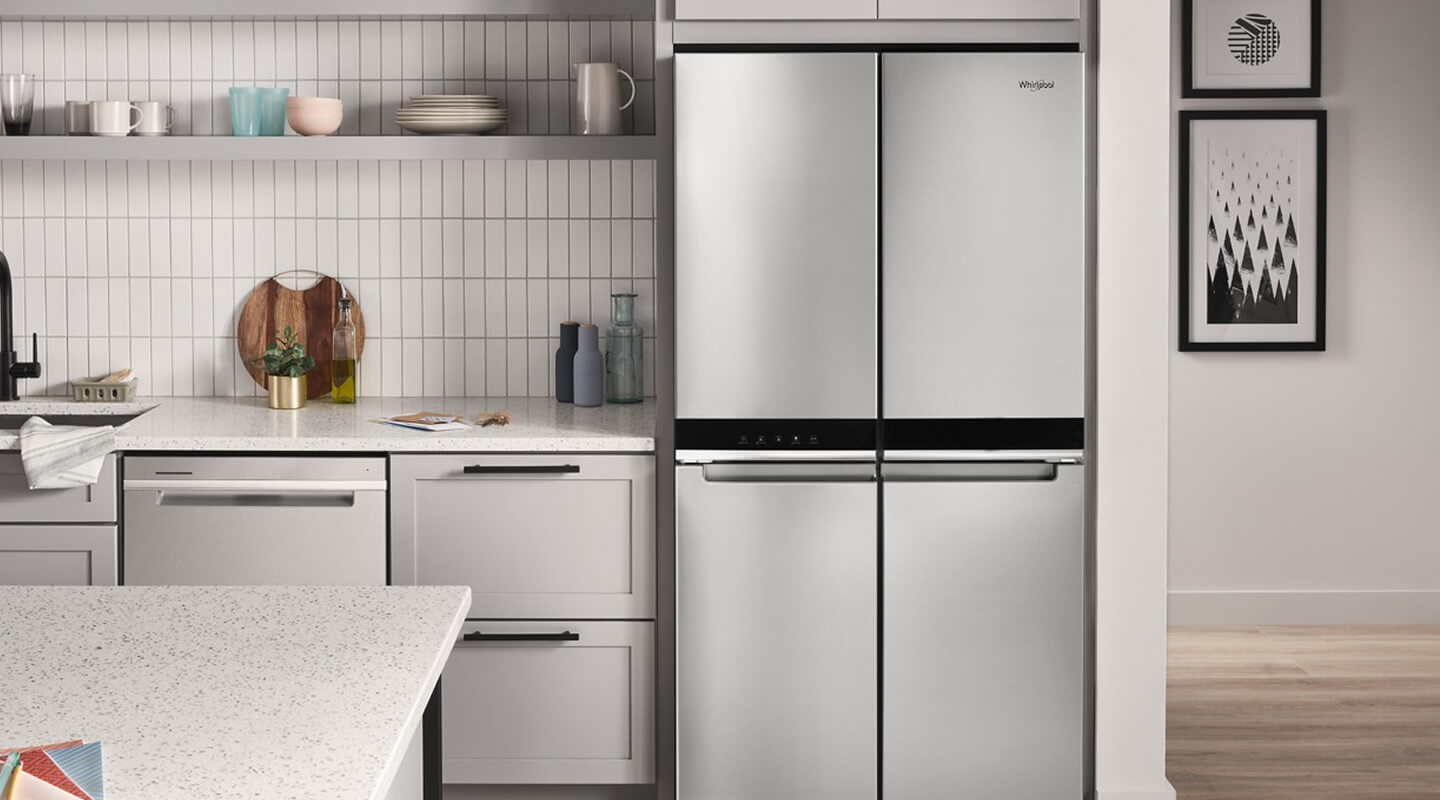 Stainless Steel Whirlpool® 4-Door Refrigerator in light gray cabinetry