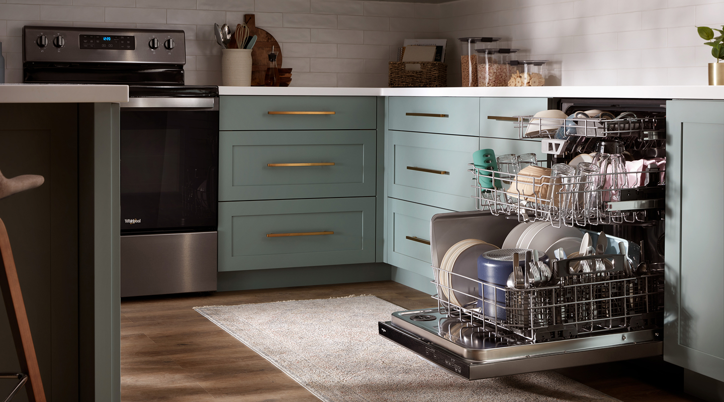 Open dishwasher filled with dishes in a modern kitchen