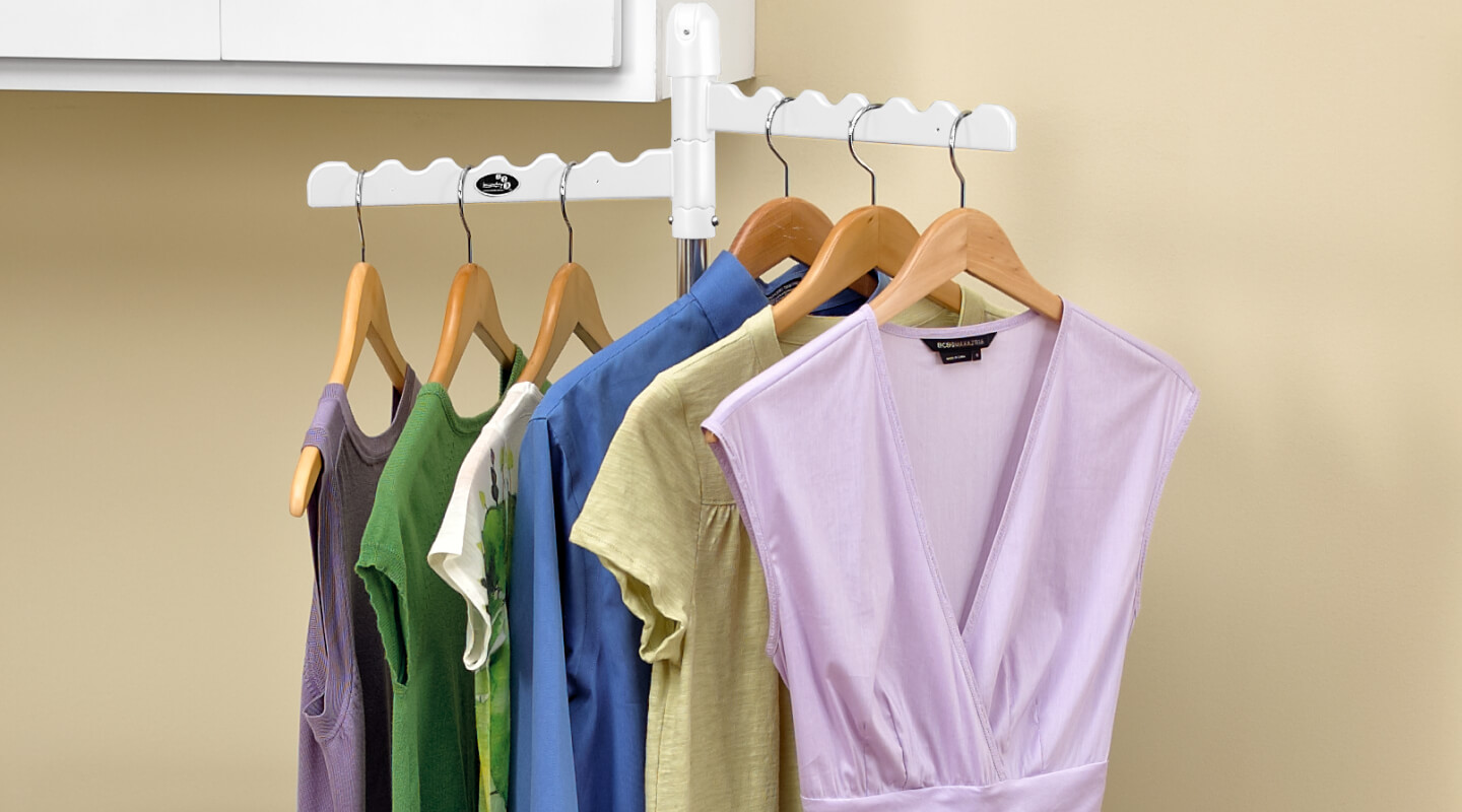 Clothing on hangers on a drying rack Clothing on hangers on a drying rack