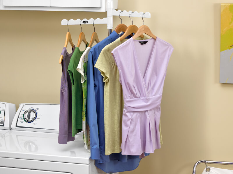 Clothing on hangers on a drying rack Clothing on hangers on a drying rack