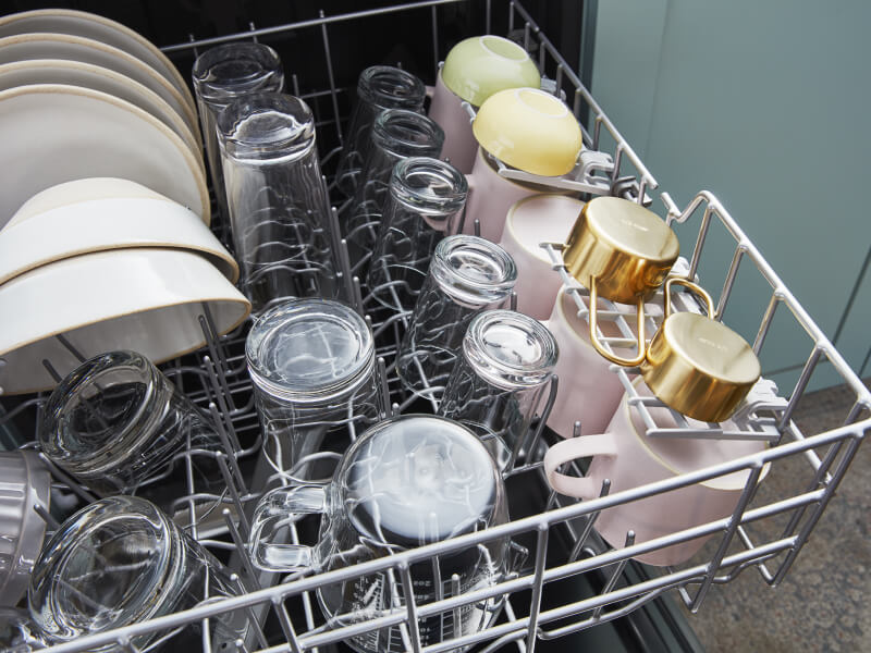 Clean and dried dishes in a dishwasher