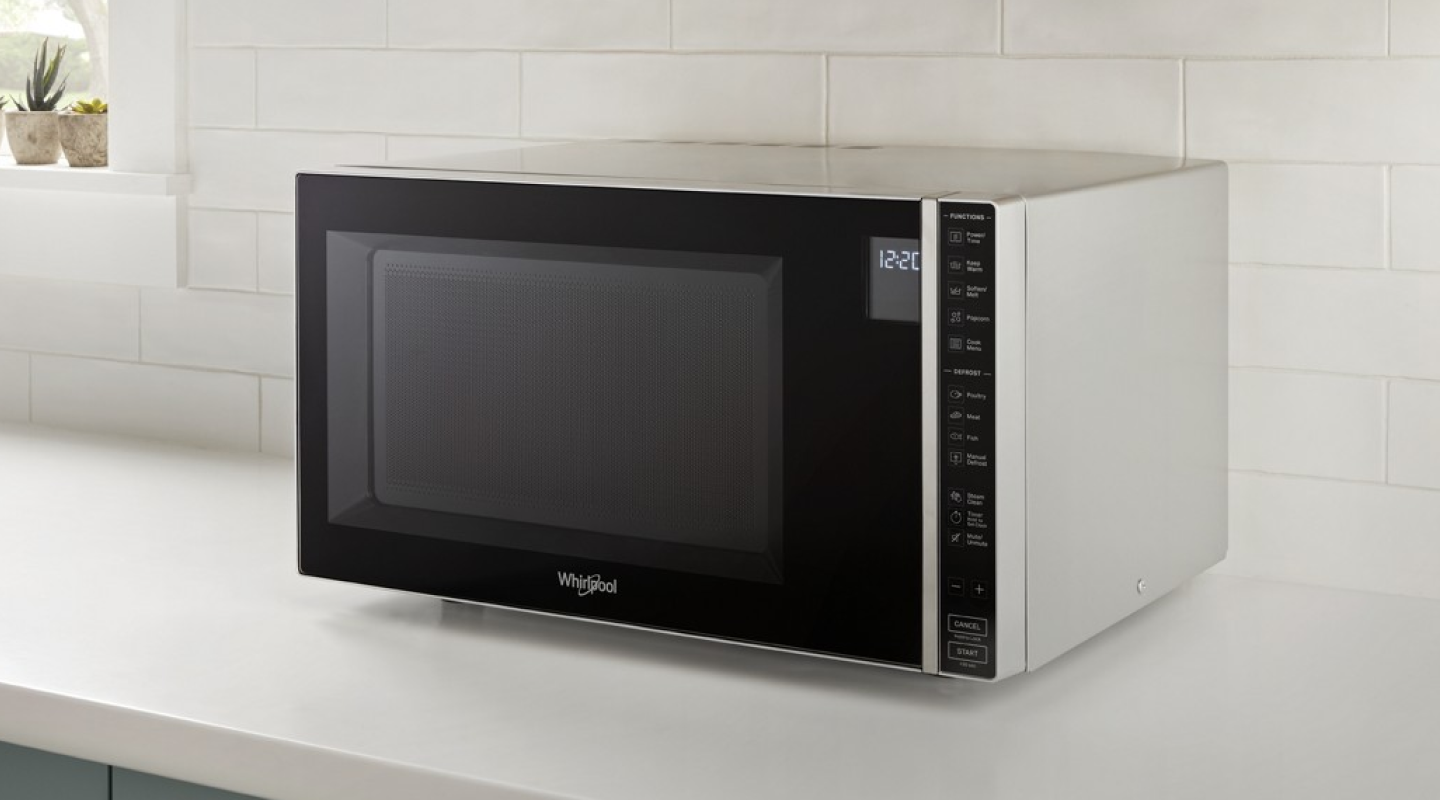 Whirlpool® countertop microwave in front of white backsplash Whirlpool® Countertop Microwave in front of white backsplash