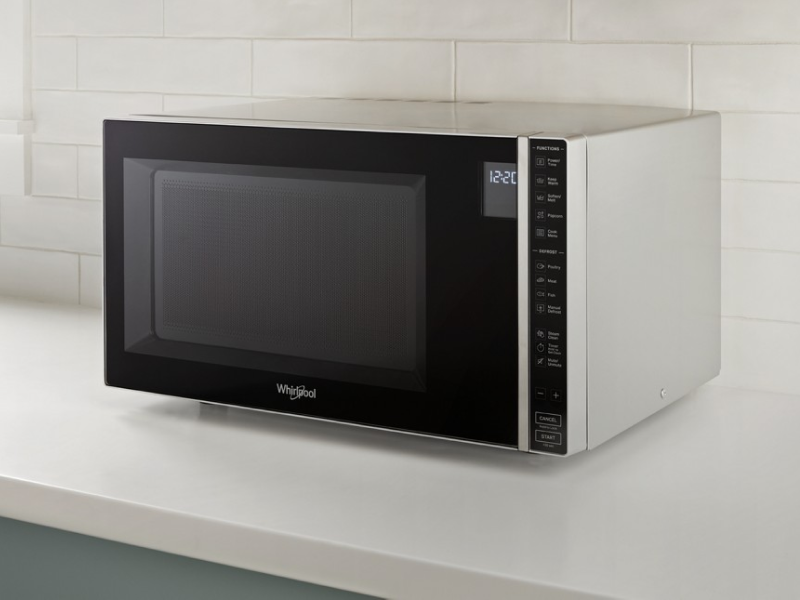 Whirlpool® Countertop Microwave in front of white backsplash Whirlpool® Countertop Microwave in front of white backsplash