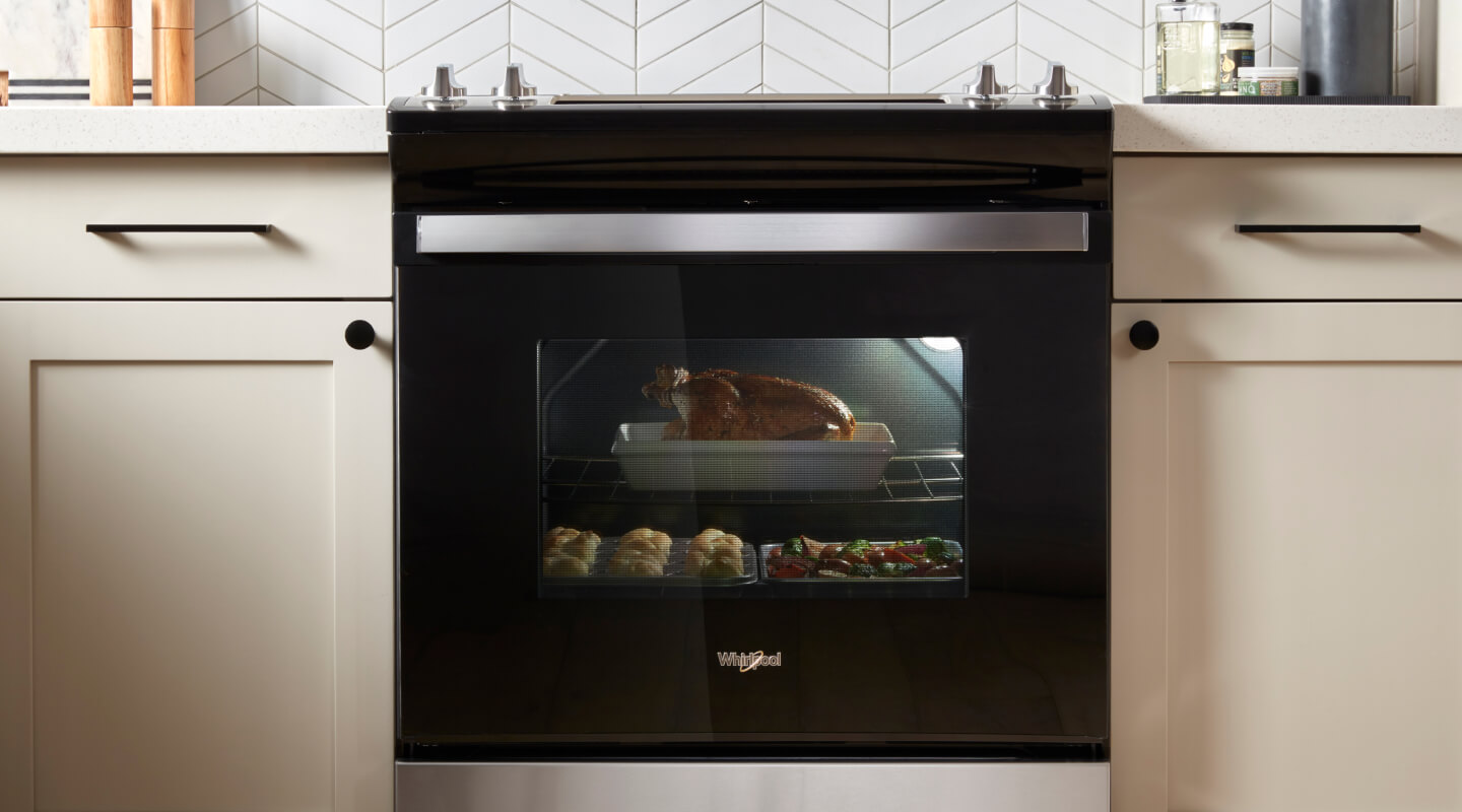 Whirlpool® Electric Oven with a turkey dinner inside