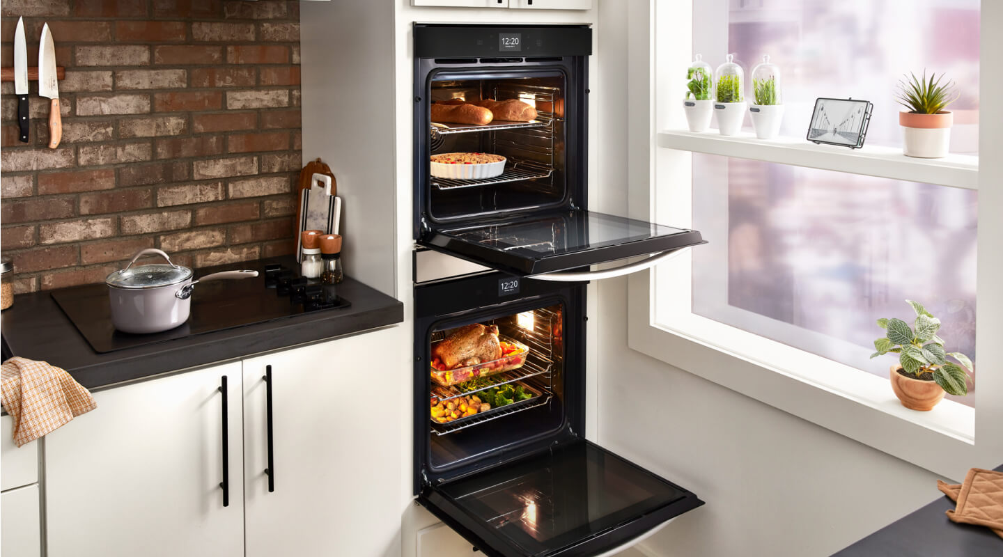 Double wall oven open to show food inside