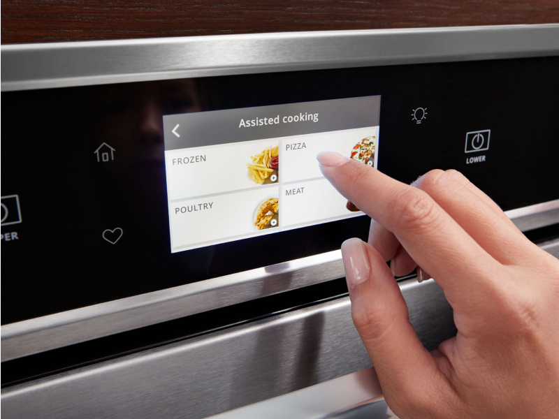 Person making a selection on a smart oven