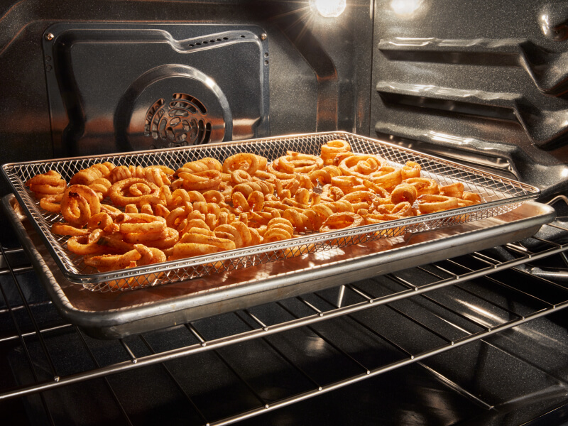 Curly fries in an oven